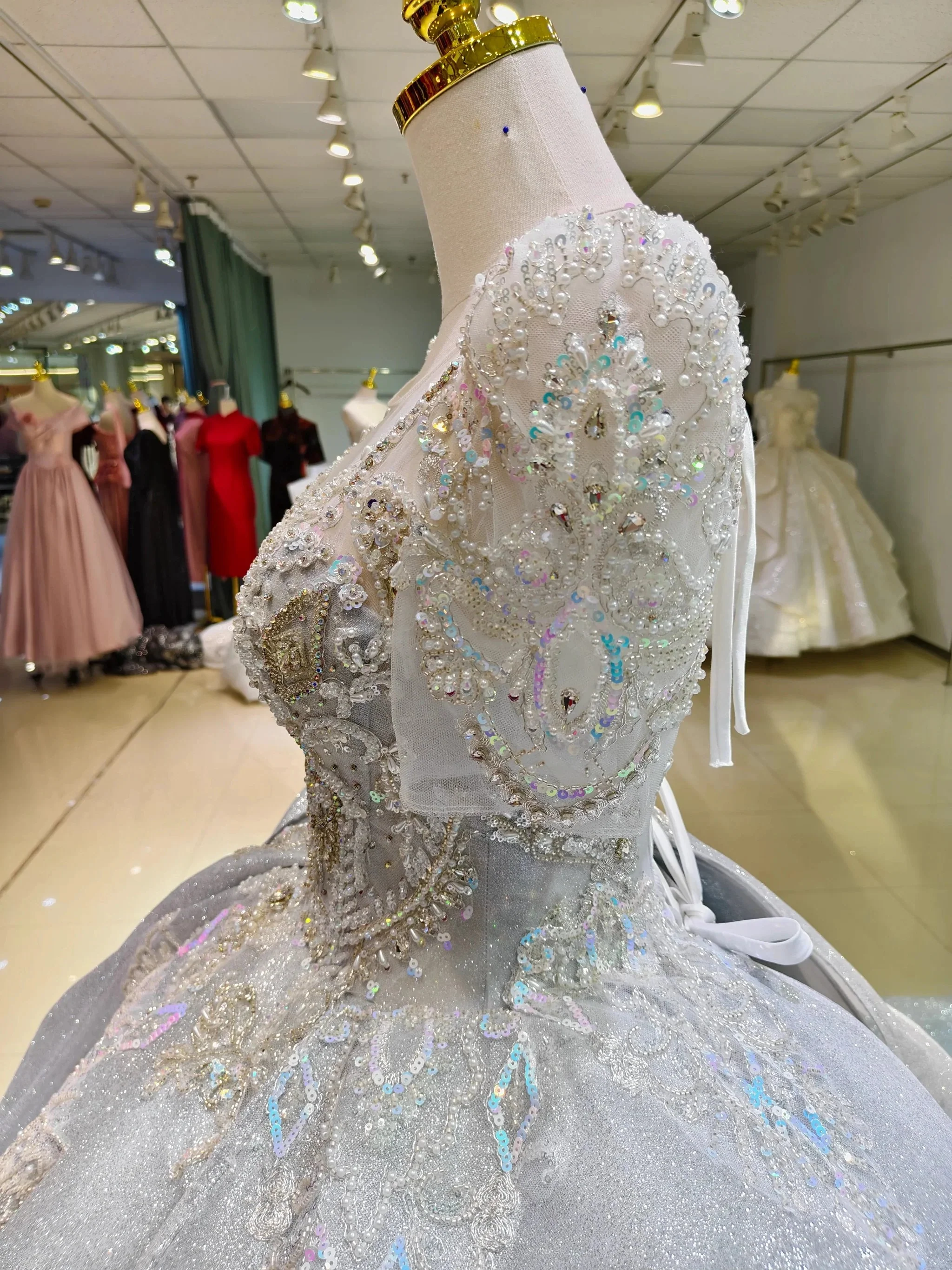 Silver Glimmer V-Neck Ballgown: Crystal-Embroidered Bust & Dramatic Bow Train - Image 4